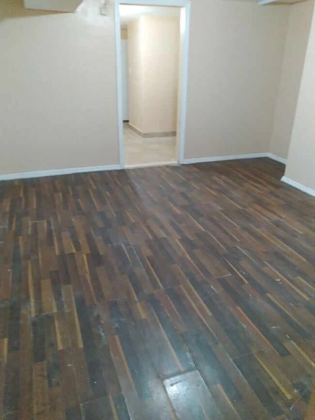 Building Photo - 3 bedrooms on the 3rd Floor with Central Hot Air, and an Available backyard