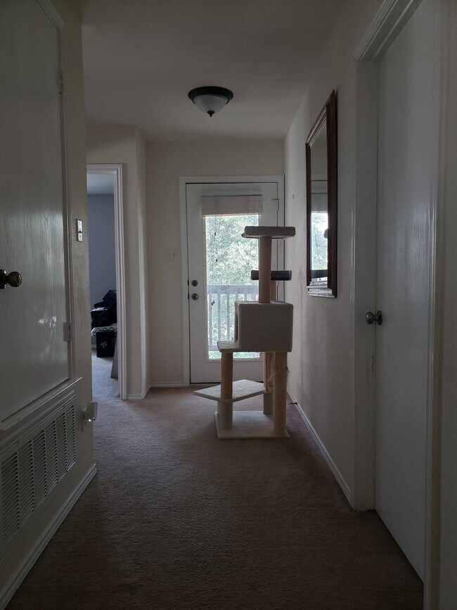 Upstairs hallway leading to balcony and guest bedrooms - 1824 Bayland St