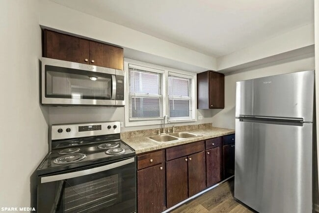 Building Photo - 7617 S Colfax Ave
