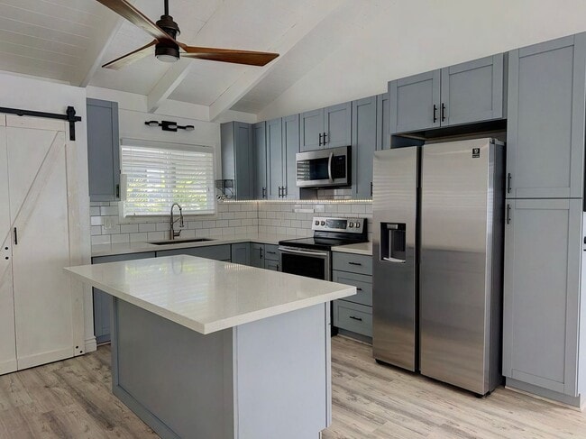 Building Photo - Mililani Town Living with PV, Tesla Batteries & EV Charger