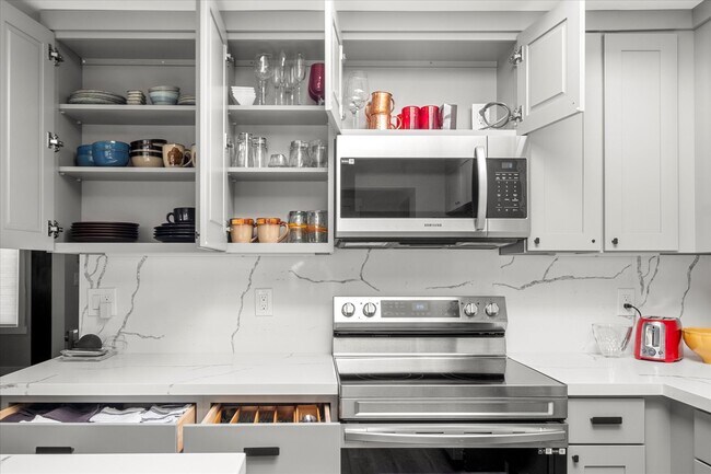 Cozy up with a bottle of wine, test cooking skills with a fully stocked kitchen. - 4206 N Winnifred St