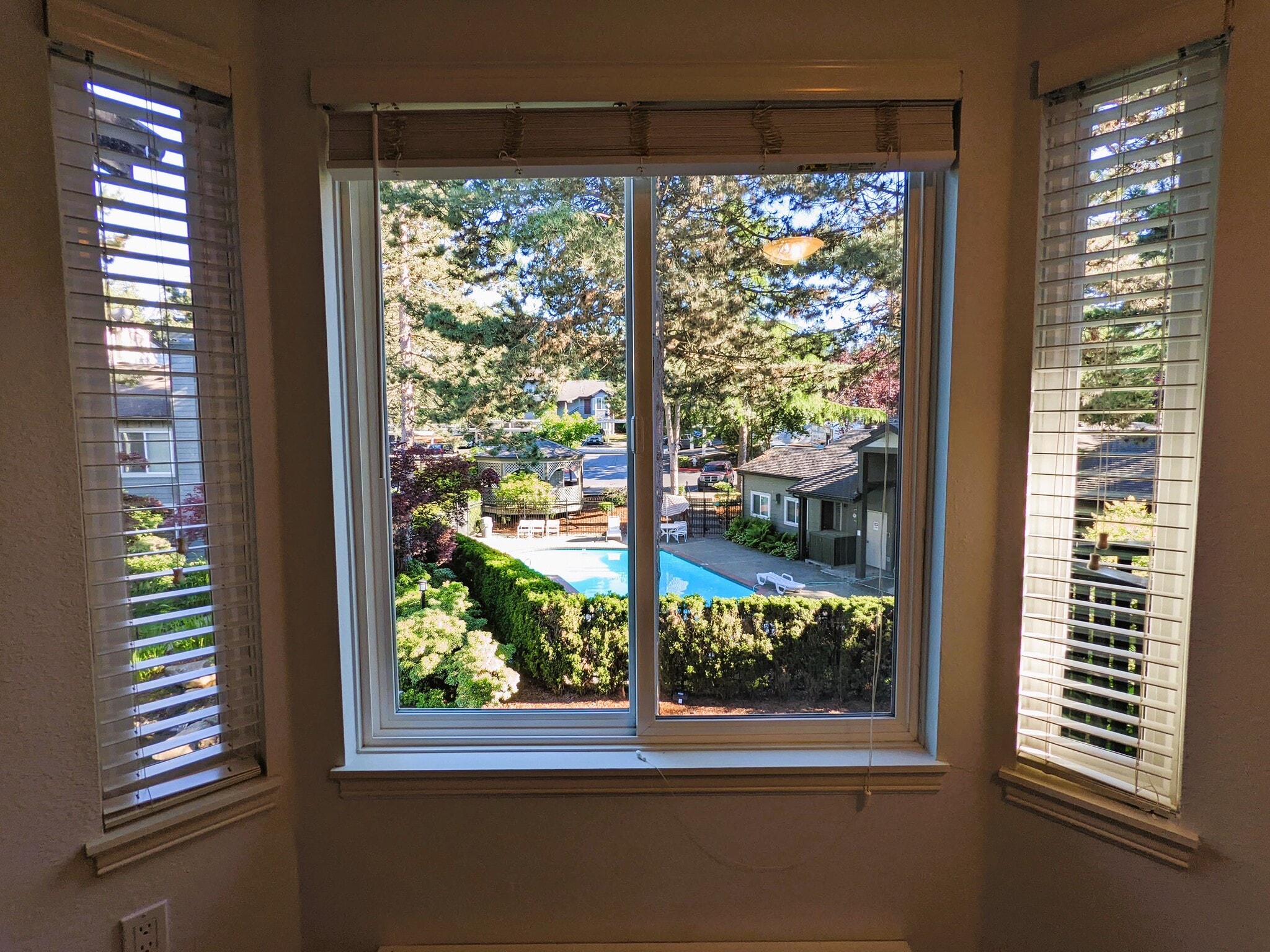 View of grounds with swimming pool and club house - 11107 NE 125th Ln