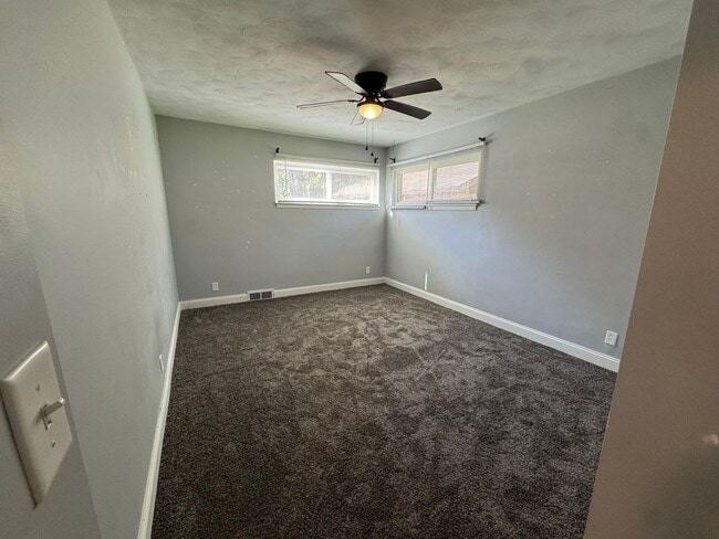 Building Photo - Large Moline Home with 3-Car Garage, Privacy, and Plenty of Space