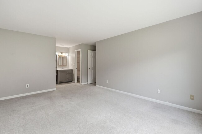 Building Photo - Contemporary design meets exceptional space in this inviting ground level residence, offering eff...