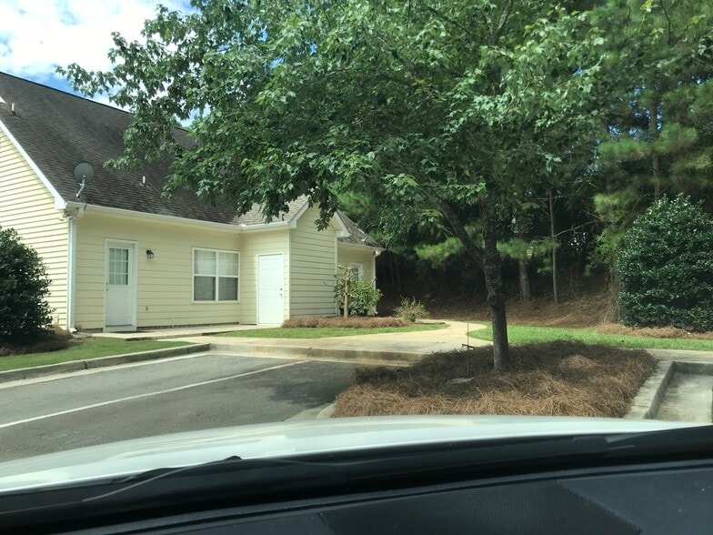 View of back of duplex from parking area. - 1305 Cedar Shoals Drive #500