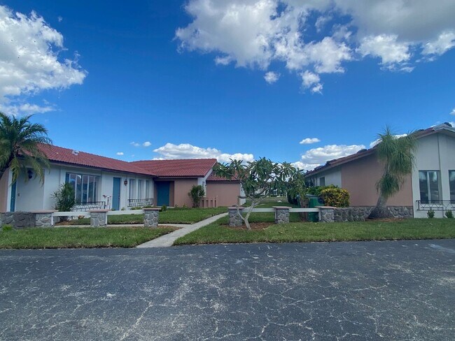 Building Photo - Updated 2-bedroom waterfront duplex with walk-in closets, enclosed Florida room, and canal views ...