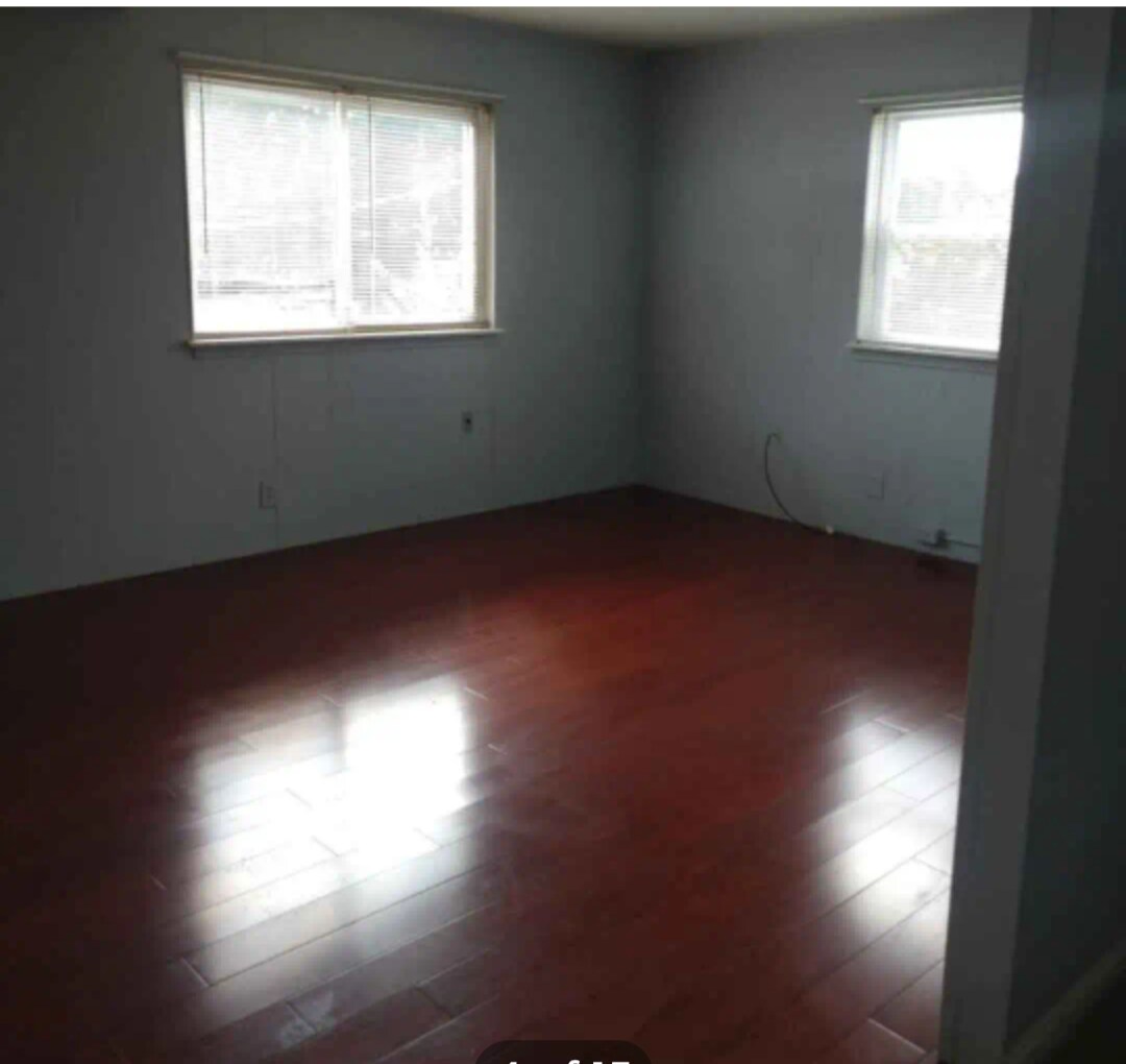 Living Room has a cherry hardwood floor - 231 Thompson Ave