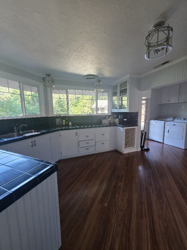 Building Photo - Breathtaking Home offers flexible living with bonus rooms ideal for an office, art studio, gym, o...