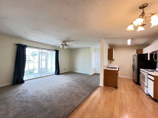 Building Photo - First Floor, Unfurnished, 3 Bedroom, 2 Bath Condo with Screened-in Back Patio!