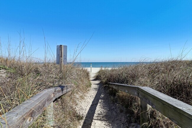 Building Photo - Live Steps from the Sand – Furnished Beach...