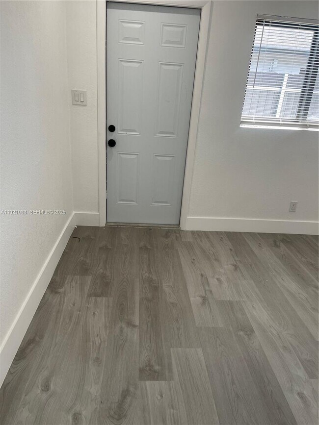 Building Photo - 880 NW 8th Ave