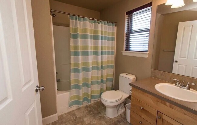 Building Photo - Spacious 4-Bedroom Home with New Paint & Carpet, Fenced Yard