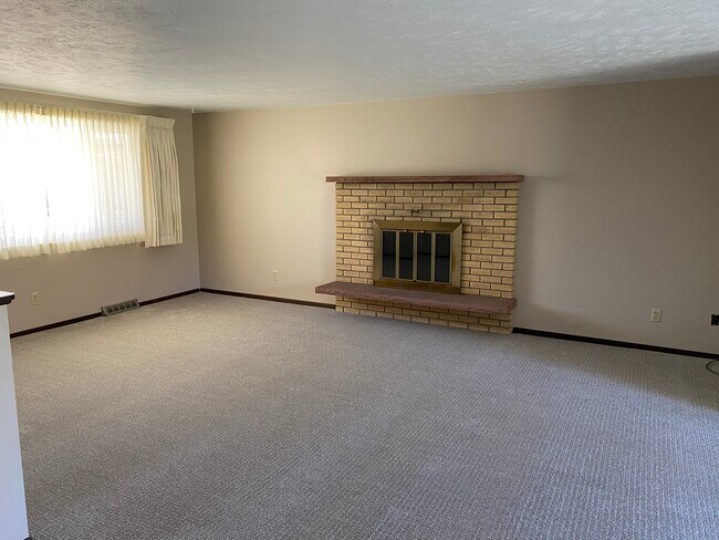 Loving room with fireplace - 2401 Dotsero Ave