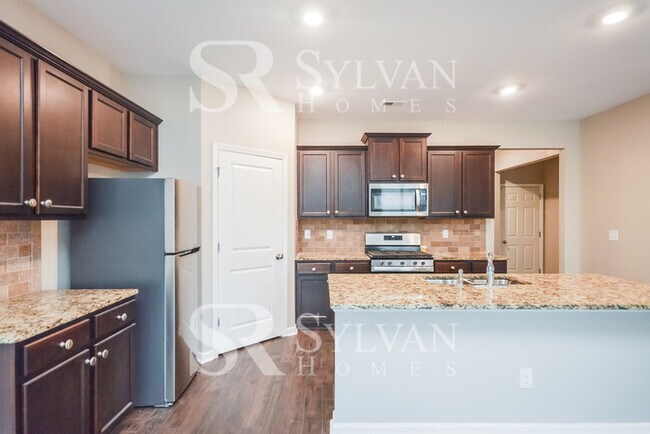 Building Photo - Don't miss out on this lovely 4BR 2BA home