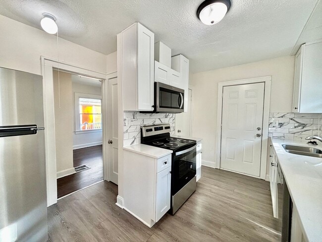 Building Photo - Fully Renovated 2-Bedroom Home with Back Deck, Basement & Off-Street Parking