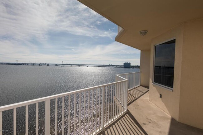 Building Photo - Beautiful waterfront condo in the gated co...