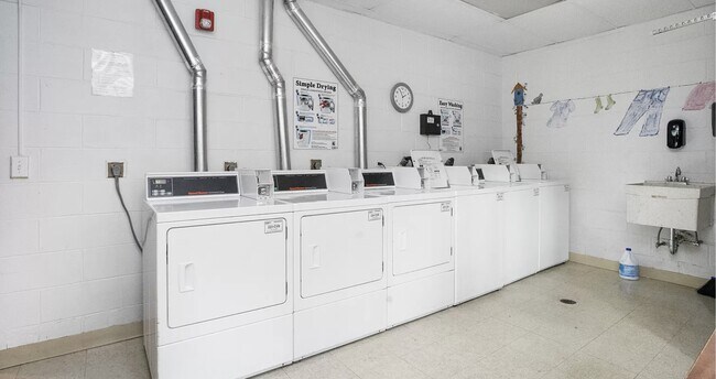 Ground-floor laundry room with mobile app operated machines. - 434 Clinton Pl