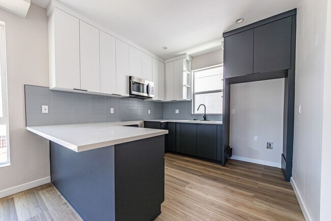 Building Photo - Contemporary 4-Bed, 4.5-Bath Townhome with...