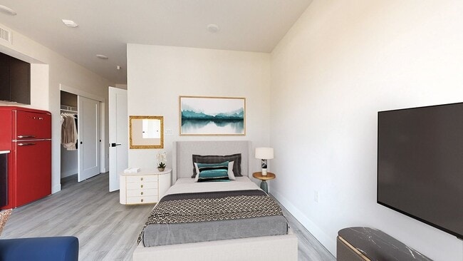 Cozy Sleeping Area in Stylish Studio Apartment - The Roost Apartments