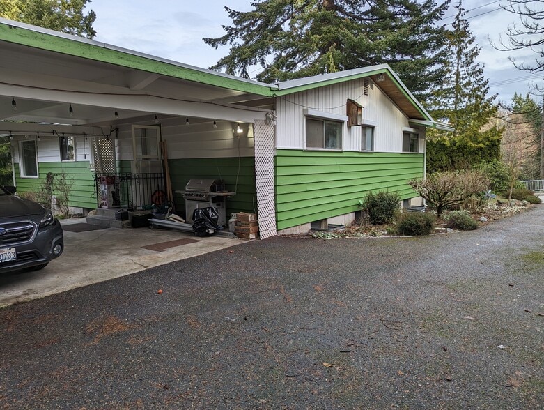 carport with drive through wrap around driveway - 2575 Yew Street Rd