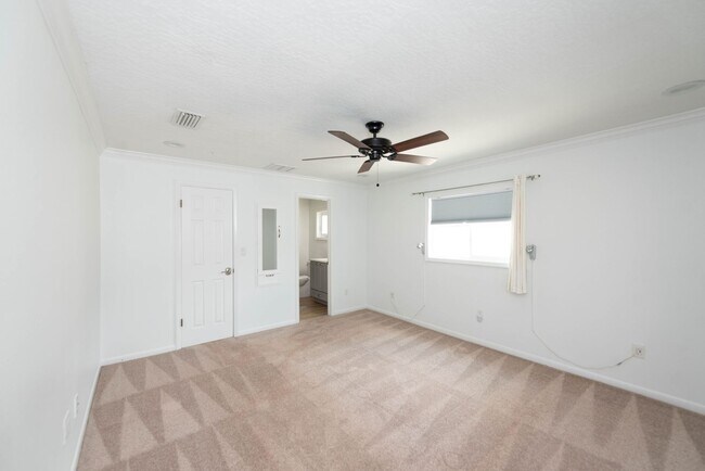 Building Photo - Live the ultimate Space Coast waterfront lifestyle at this stunning beachside canal home in Satel...