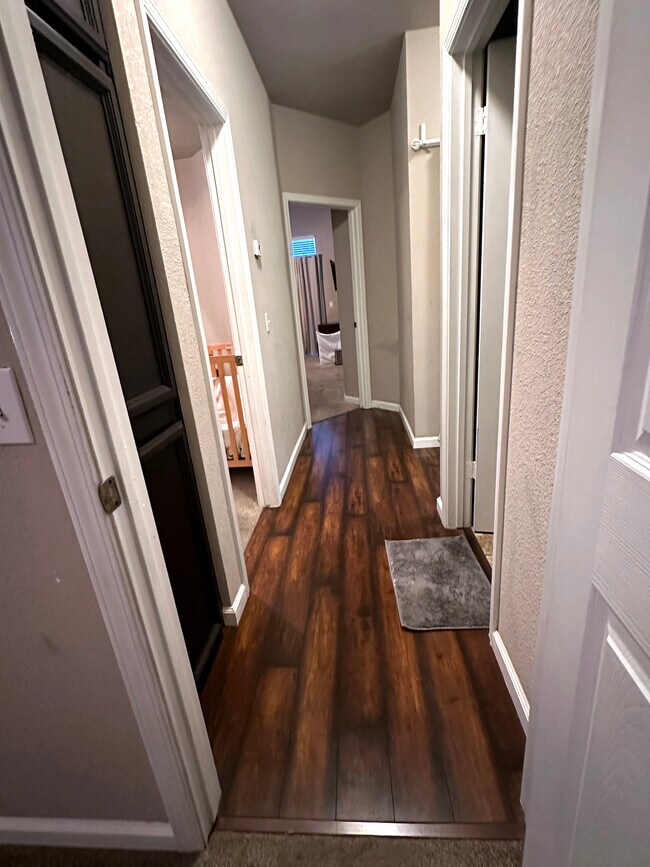 Hallway to Air conditioning control & to all Rooms - 9316 Caulfield Dr