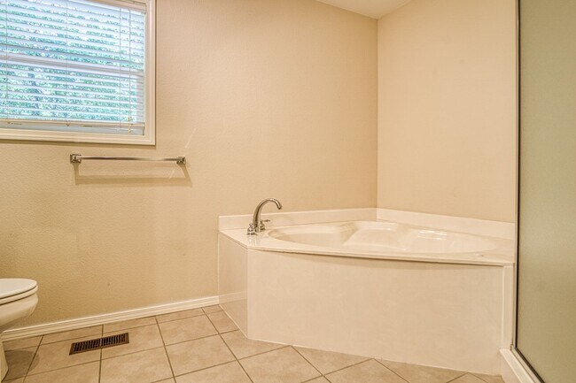 Building Photo - This beautiful home is located in a quiet private neighborhood and perfect for a serene living at...