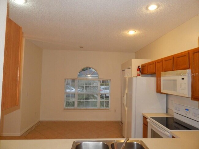 Building Photo - **Charming 4BR/2BA Pond-View Home with Boat Ramp Access – East Orlando **