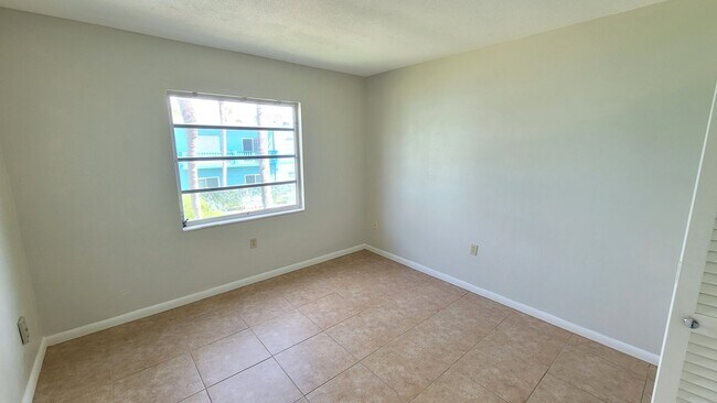 Building Photo - Cozy Beachside Condo in Cape Canaveral Including pool, basic cable, and water.
