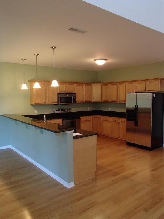 Building Photo - CLOSE TO FT. RILEY, FENCED BACKYARD!