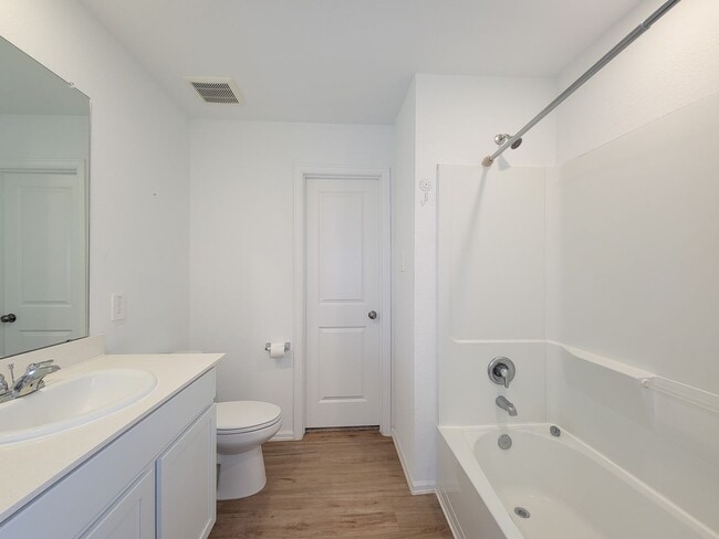 Building Photo - This single-story home has a comfortable layout with three bedrooms and a living area all on one ...