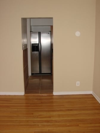 Standing in the living room and looking into the kitchen 1317 1/2 Touhy #2N - Touhy - by - the - Lake
