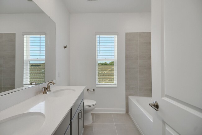 Building Photo - Stunning 4/3 in Gated Dora Parc! Water Views!