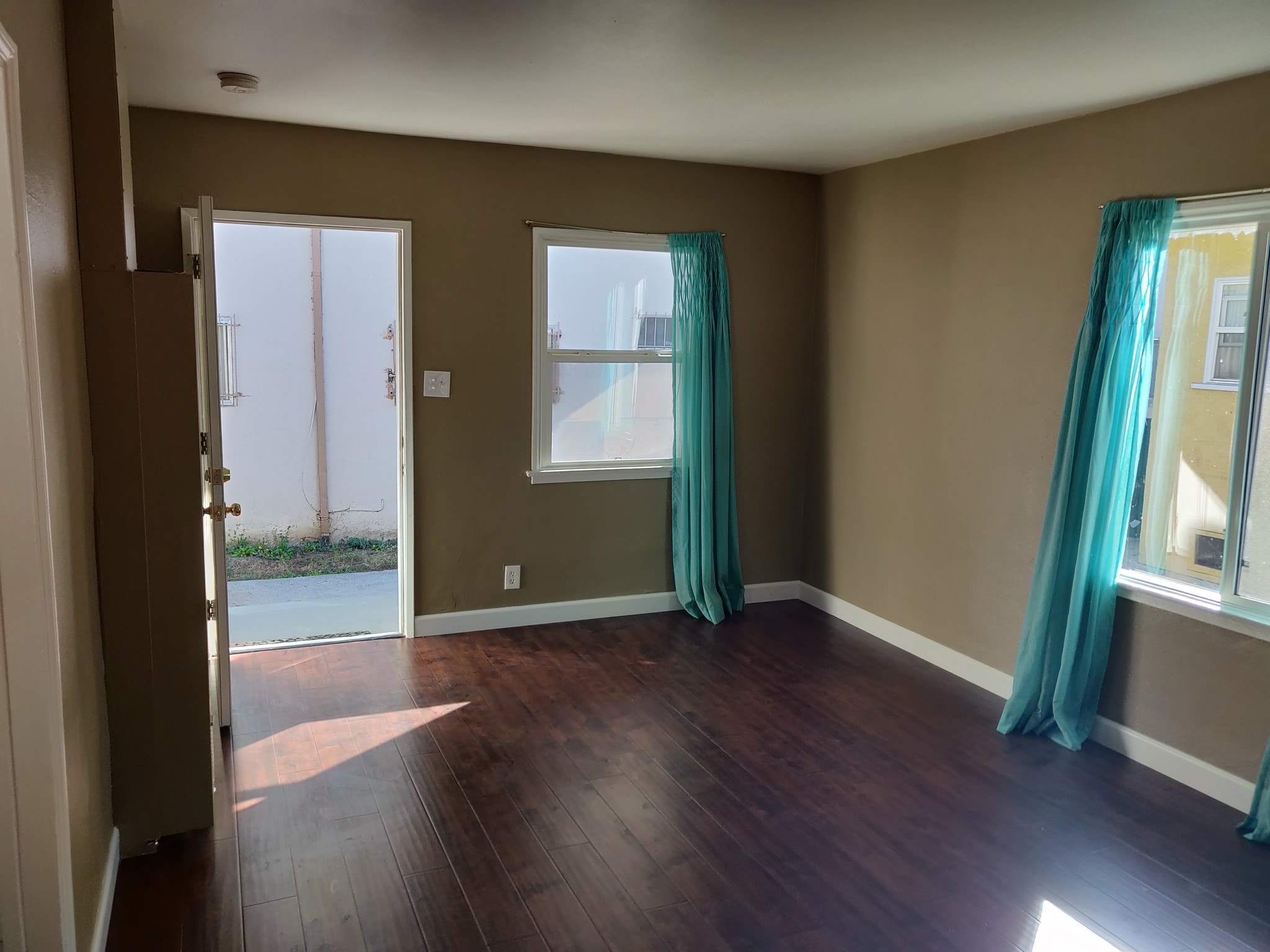 living room showing front door entrance - 6414 10th Ave