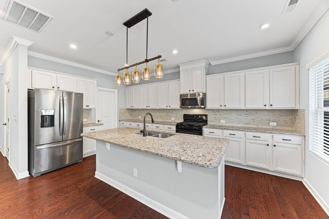 Building Photo - Classic finishes paired with an open, versatile layout!