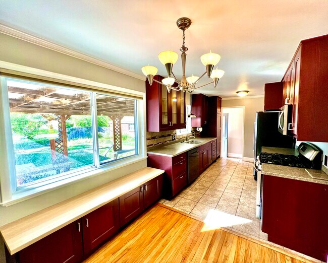 Dining room and updated kitchen - 3096 S Marie Cir