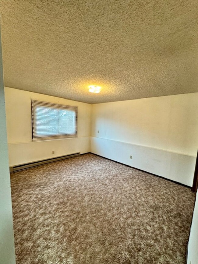 Building Photo - Charming 2-Bedroom Apartment Near MSU – Ca...