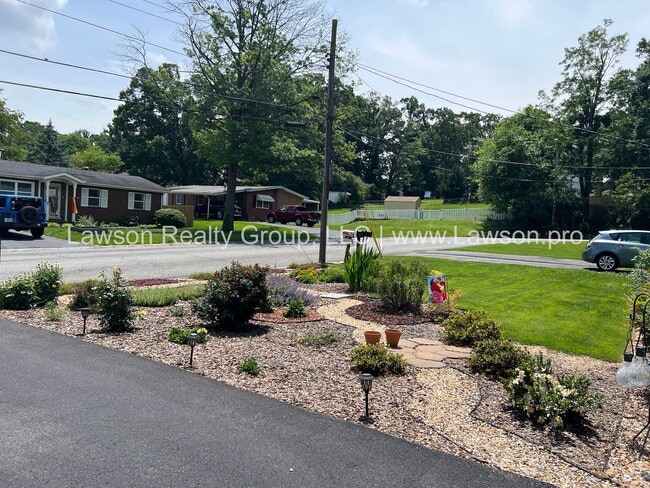Building Photo - Charming Brick Ranch with Beautifully Land...