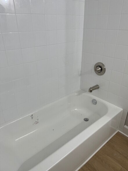 Tiled Bathtub In Second Bathroom - 16251 Dublin Cir