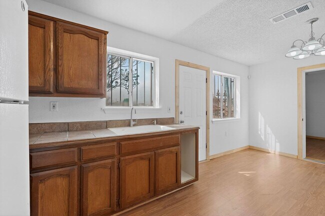 Building Photo - Rural South Valley 4 Bedroom  1.75 Bath 1256/sf