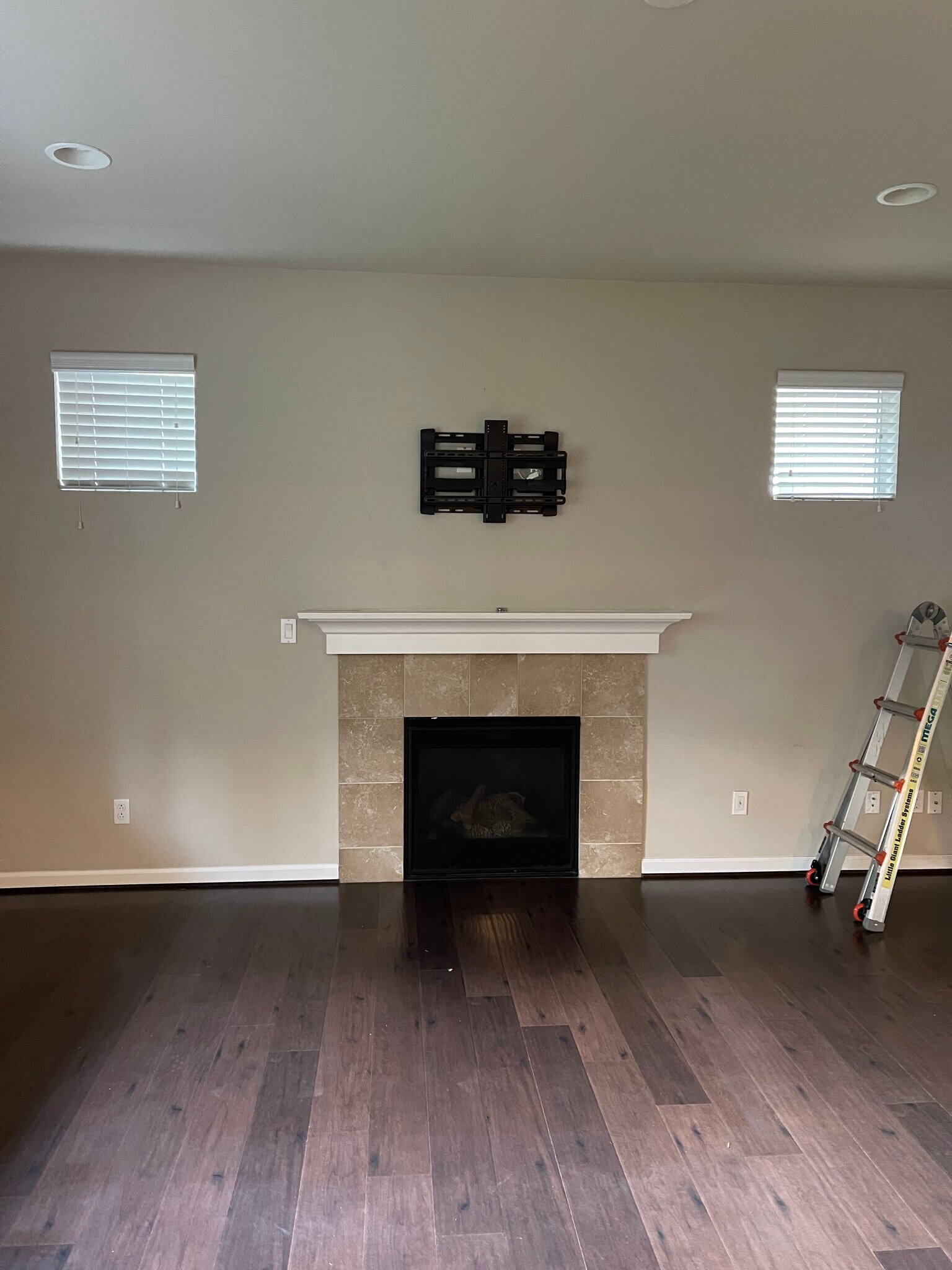 FP in downstiars living room,. TV mount above FP supports up to 77 inch TV - 8828 Jayden Ln NE