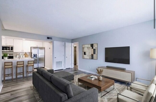 Building Photo - Spacious 2-Bedroom Elite Apartment with Private Balconies & Washer/Dryer