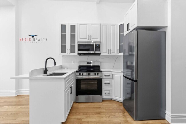 Building Photo - 21-28-28 48th St