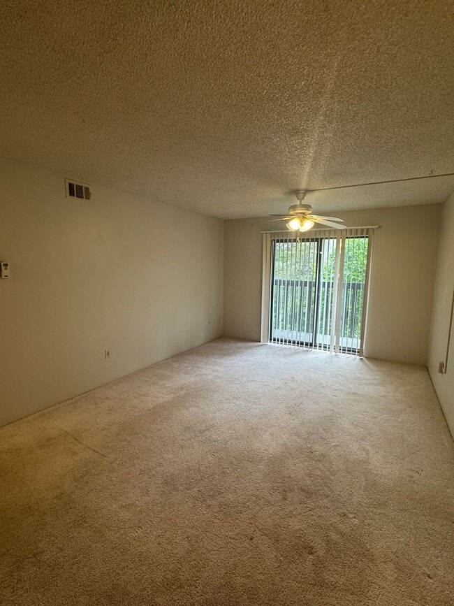 Building Photo - Spacious 2-Bedroom, 1.5-Bath Condo in Bear...