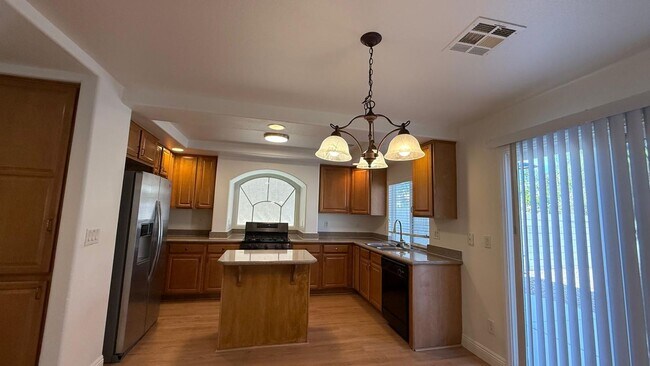 Building Photo - New flooring and freshly painted 4 bedroom home
