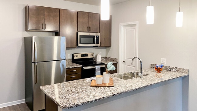 Studio, One-, Two-, & Three-Bedroom Apartments at Latitude 41 - Latitude 41