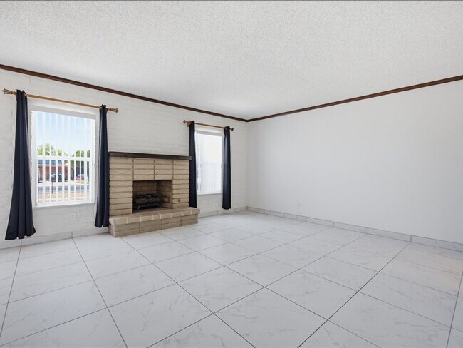 Building Photo - Concept Living with Large Enclosed Backyard & Modern Upgrades!
