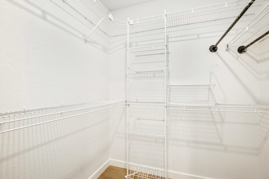 Step into luxury! Our spacious, organized walk-in closet is a stylish haven for your belongings. - 4110 Mount Alifan Pl