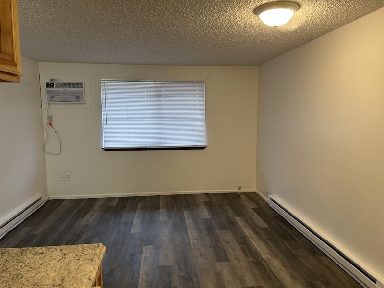 Living Room, NEW AC and Baseboard Heaters - 3023 N Hogan St