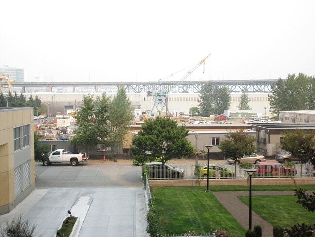 Building Photo - Meriwether West - North facing studio with river/bridge views/parking/amenities/utilities